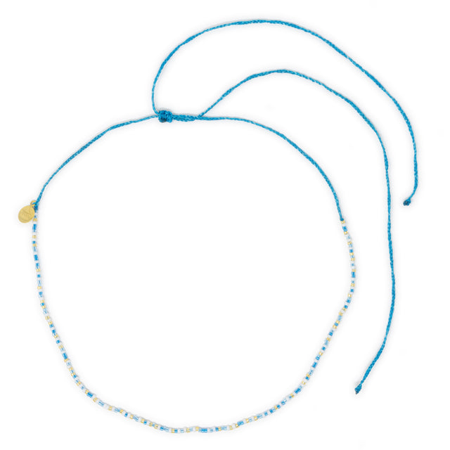 Blues & gold beaded waterproof choker shown on white top view
