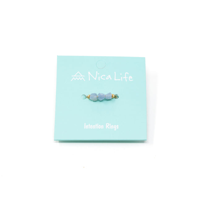 Blue opal and gold ring on mint Nica Life branded card