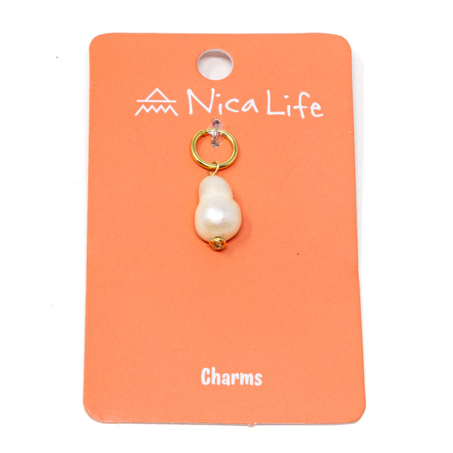 White pearl charm on coral Nica Life branded card