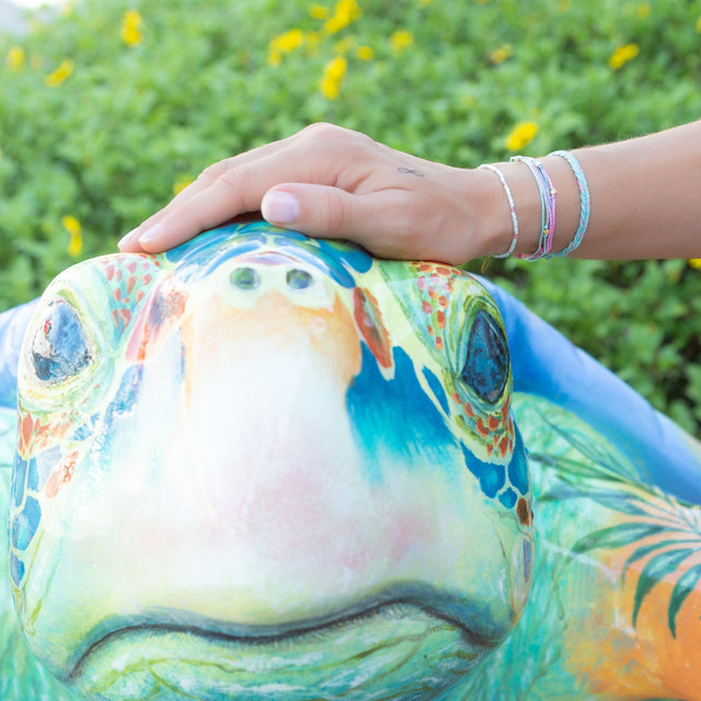 Pink & Teal Bracelet Stack on Model with Turtle Statue