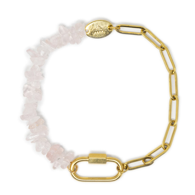Charm bracelet with gold chain and rose quartz stone beads on a white background
