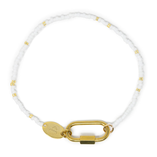 White bead charm bar bracelet with gold chain carabiner for charms on a white background