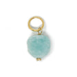 Turquoise color amazonite stone ciharm with gold ring on a white background