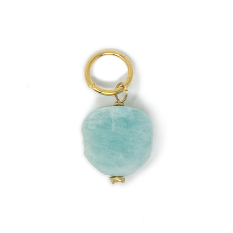 Turquoise color amazonite stone ciharm with gold ring on a white background