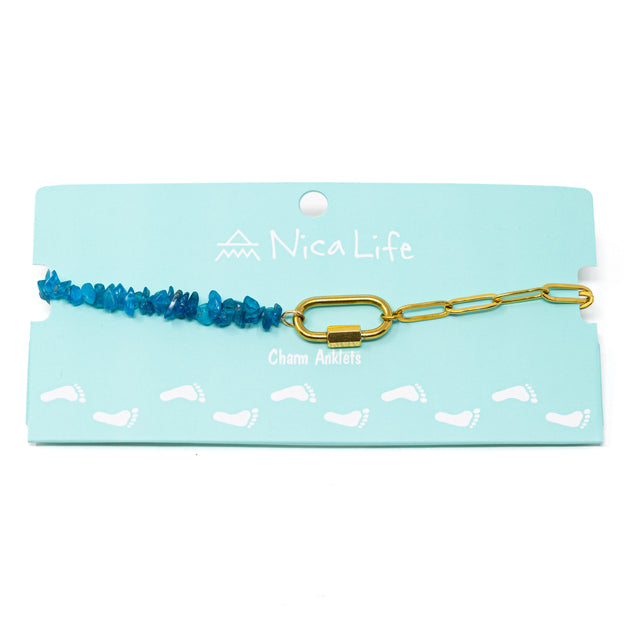 Anklet with blue apatite beads and gold chain with a gold carabiner clasp on a Nica Life branded card
