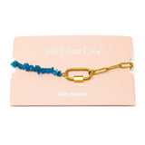Bracelet with bright blue apatite beads and gold chain with a gold carabiner clasp for charms on a Nica Life branded card