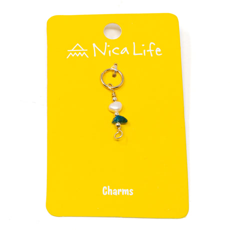 Apatite and pearl charm for charm necklace or bracelet shown on golden yellow Nica Life branded card