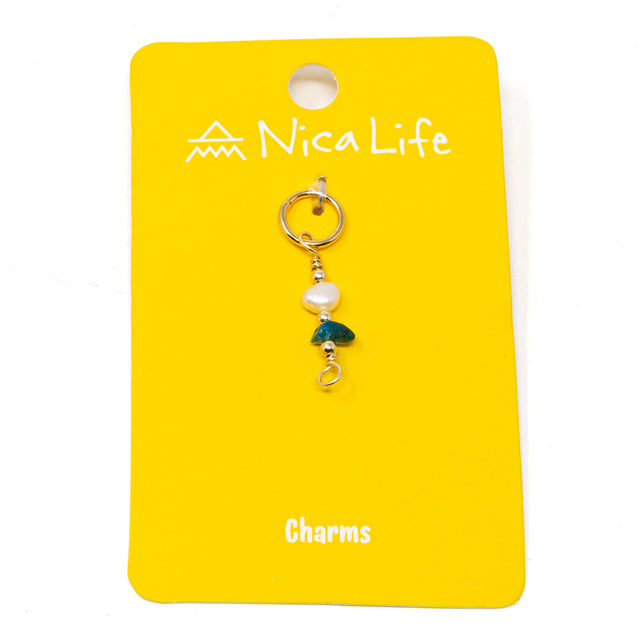 Apatite and pearl charm for charm necklace or bracelet shown on golden yellow Nica Life branded card