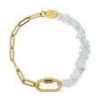 Gold chain charm bracelet with aquamarine beads and a carabiner clasp on a white background
