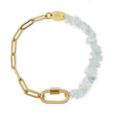 Gold chain charm bracelet with aquamarine beads and a carabiner clasp on a white background