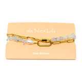 Gold chain & aquamarine charm necklace with carabiner clasp on Nica Life branded card