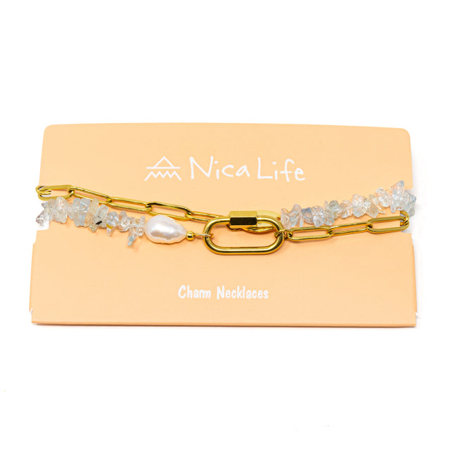 Gold chain & aquamarine charm necklace with carabiner clasp on Nica Life branded card