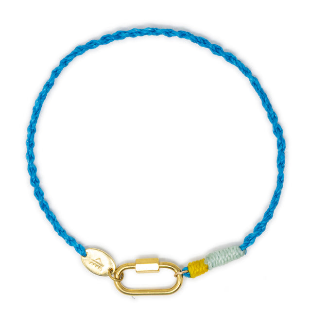 Blue braided cord anklet with a gold carabiner clasp for charms on a white background