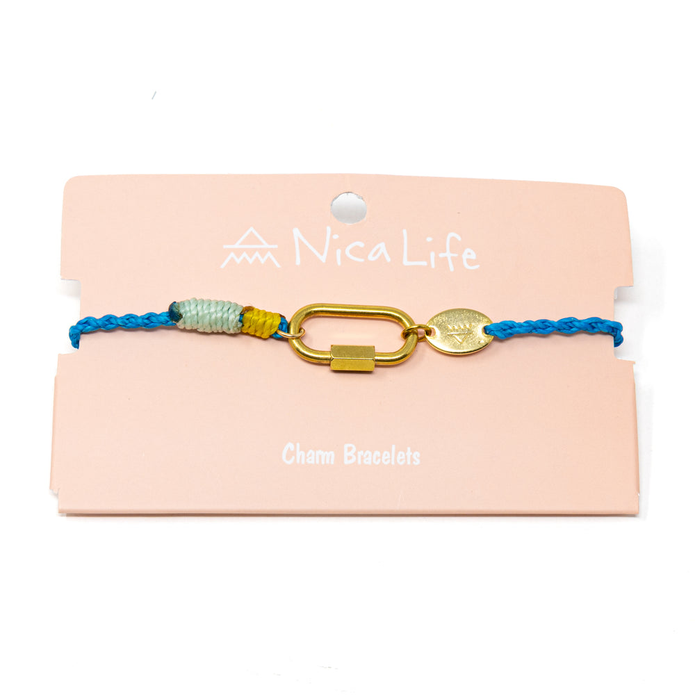 Cord charm bracelet with gold  carabiner clasp for charms on a pink card with 'Nica Life' branding