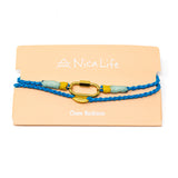 Hand braided rope charm necklace in blue with mint and yellow accents, features a carabiner clasp for charms and is shown on a Nica Life branded card