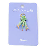 Hand beaded mint & coral octopus charm for charm bracelet or necklace on purple Nica Life branded card