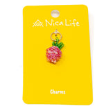Hand beaded strawberry charm on a yellow card with 'Nica Life' branding