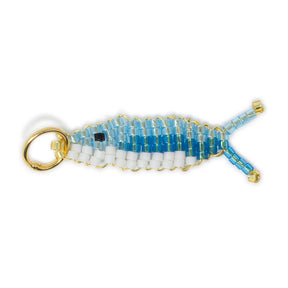 Two tone handed beaded blue fish charm for charm necklace or bracelet shown on white