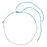 Blues & gold beaded waterproof choker shown on white top view