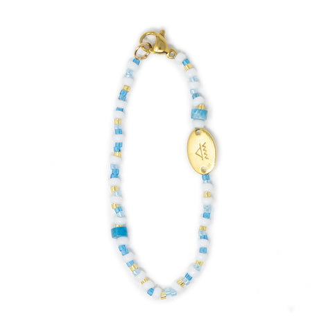 Blue multicolor hand beaded bag charm shown on white 