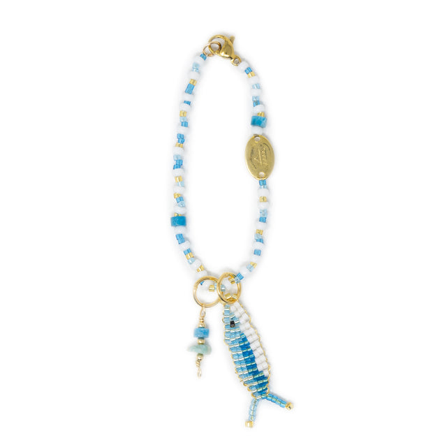 Beaded bag charm with a fish charm and stone charm on a white background