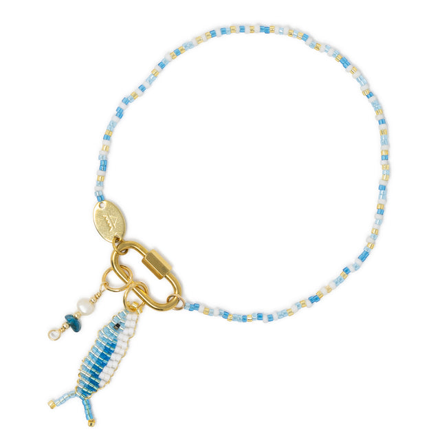 Blues seed bead anklet with two tone fish charm and apatite & pearl charm on carabiner clasp show on withe 