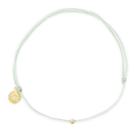 Cucumber mint color thread anklet with gold filled bead on white top view