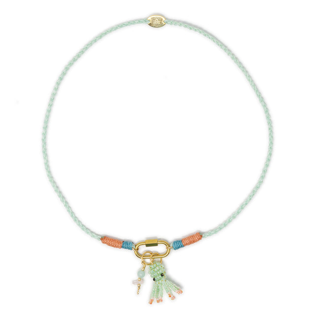 Hand braided mint cord charm necklace show with octopus & stone charms on white