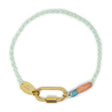 Bracelet with gold carabiner clasp for charms handmade with colorful cord on a white background