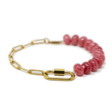 Dark pink poney bead and gold chain charm bar bracelet with gold carabiner for clasps shown on white front