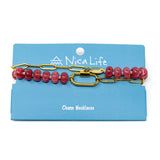 Pink stone pony bead & gold chain charm necklace with a carabiner clasp to hold charms shown on a navy Nica Life branded card