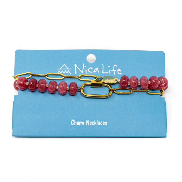 Pink stone pony bead & gold chain charm necklace with a carabiner clasp to hold charms shown on a navy Nica Life branded card