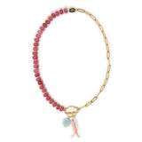 Dark pink stone pony bead & gold chain charm necklace with pink fish & amazonite charm shown on carabiner clasp on white 