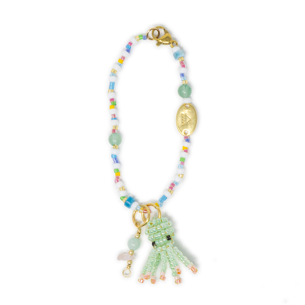 Beaded bag charm with a green octopus charm on a white background