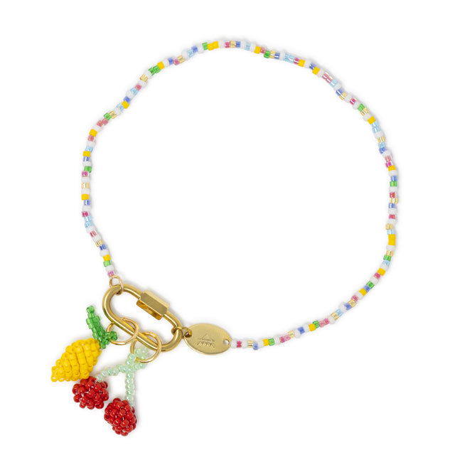 Bright color beaded charm bar anklet with carabiner clasp holding lemon and cherry charms on white