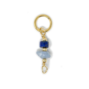 Lapis and blue opal stone charm shown on white