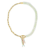 Necklace with gold chain and beaded section, featuring colorful fish & stone charm on the carabiner clasp  on a white background