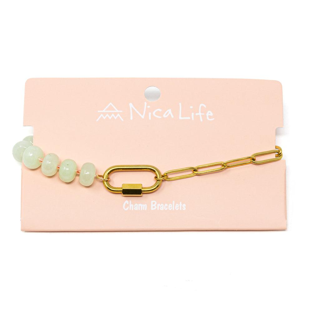 Mint stone pony beads and gold chain charm bar bracelet with a gold carabiner for charms on a pink branded Nica Life card