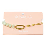 Mint stone pony beads and gold chain charm bar bracelet with a gold carabiner for charms on a pink branded Nica Life card