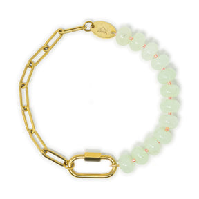 Bracelet with gold chain and mint stone pony beads with a gold carabiner for charms on a white background