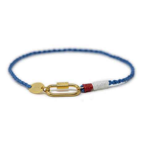 Hand braided rope charm anklet in nautical blue red and white colors with a gold carabiner clasp for charms show on white from the front 