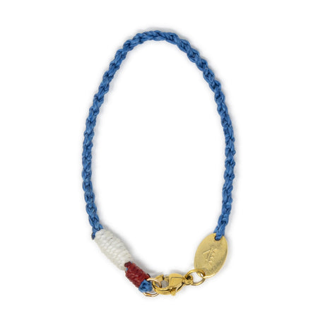 Blue braided bag charm with a gold clasp and accents  on a white background