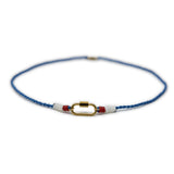 Necklace with blue, white, and red cord and gold carabiner clasp for charms on a white background from front view
