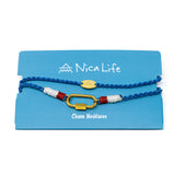 Blue cord charm bar necklace with nautical vibes and a gold carabiner clasp for charms shown on a blue Nica Life branded card.