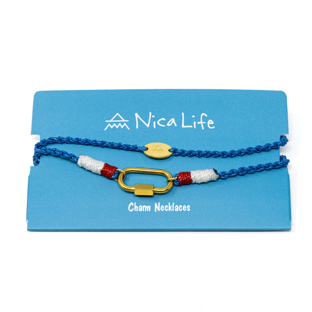 Blue cord charm bar necklace with nautical vibes and a gold carabiner clasp for charms shown on a blue Nica Life branded card.
