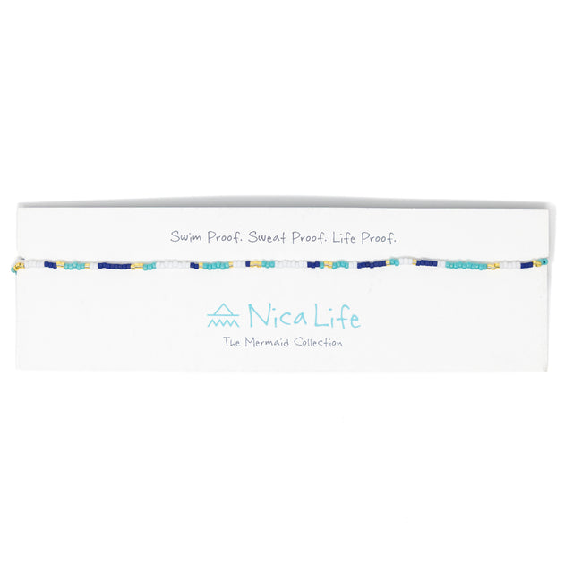Navy and teal baded choker shown on a Nica life branded card. 