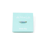 Blue opal and gold ring on mint Nica Life branded card
