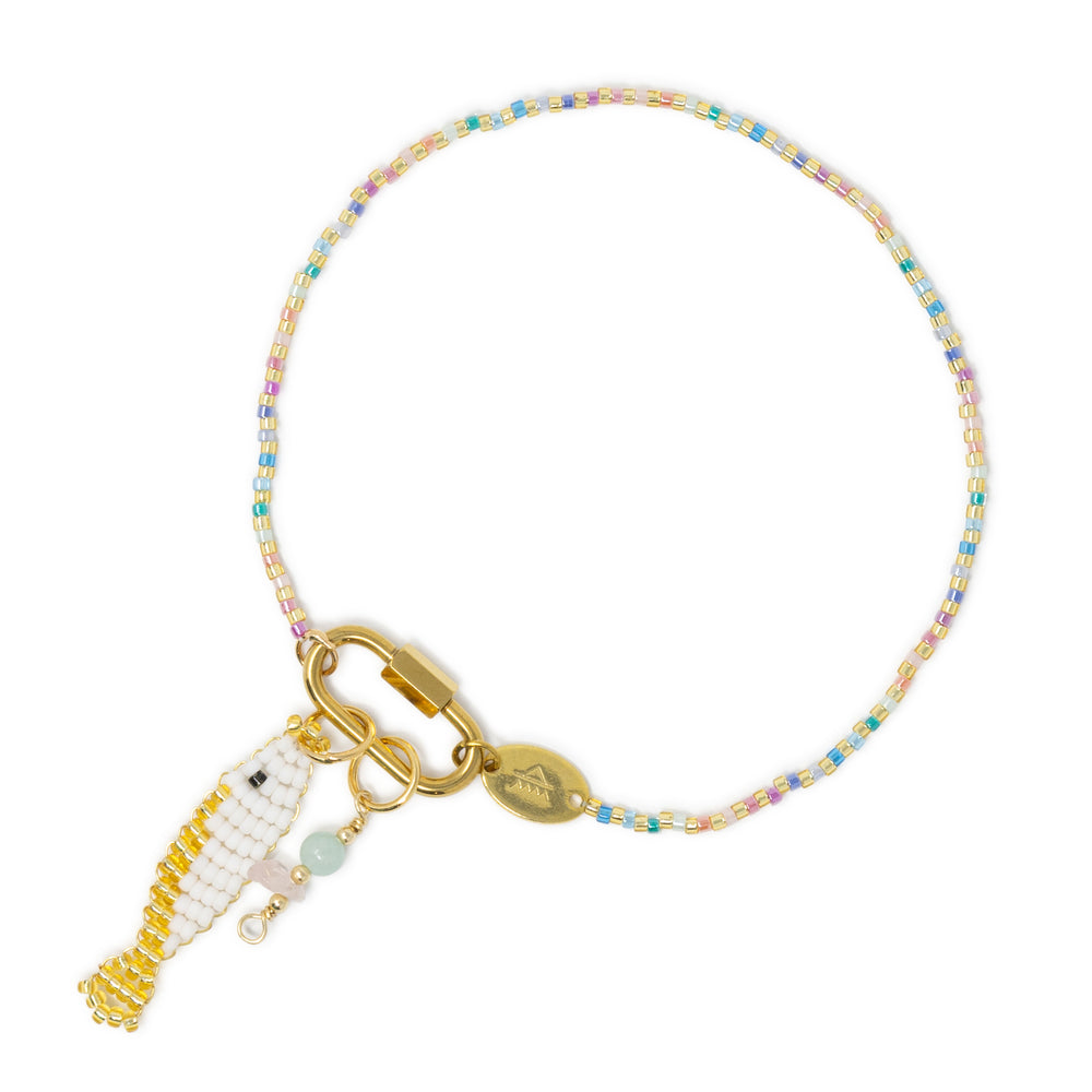 Pastel rainbow beaded anklet with carabiner claps holding a white & gold fish charm and an amazonite & rose quartz charm shown on white.