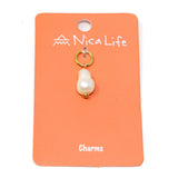 White pearl charm on coral Nica Life branded card