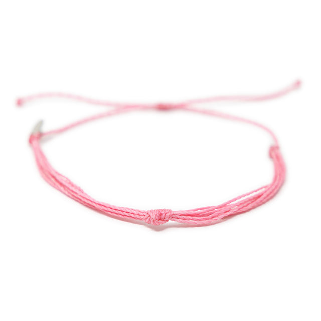 Bright pink string knot anklet on white front view
